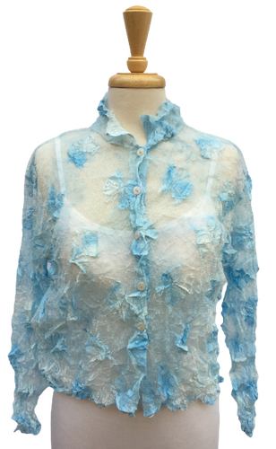 Crinkle 12 Long-sleeve, button-up crinkle top with allover butterfly detailing. Sheer. Made in France.