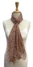 SL03-29 Purple and yellow animal print scarf with curled edges.