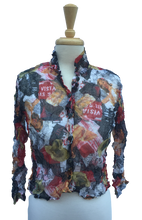 30.1B Long-sleeve, button-up crinkle top with a multicolored magazine-style print. Made in France